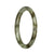 A close-up image of a petite round jade bangle bracelet with grey and olive green patterns.