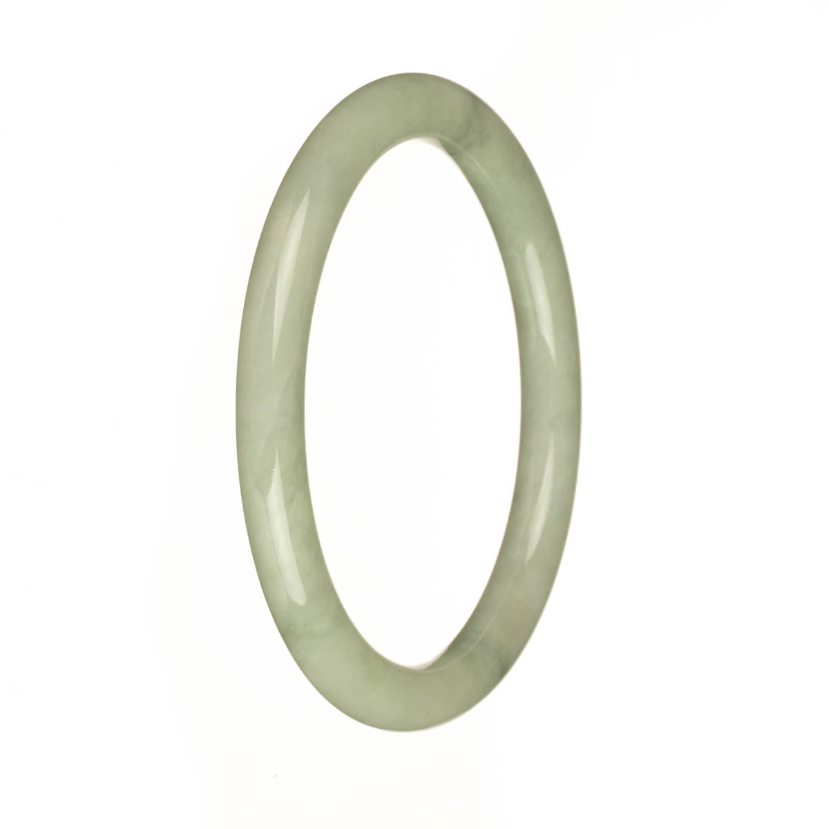 A petite round green jade bangle bracelet, crafted from real natural light green jade.