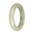 A half-moon shaped jadeite bracelet with authentic untreated greyish white color and deep green patterns. Measures 58mm.