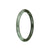 An olive green and pale green traditional jade bangle with an authentic Grade A quality. It is petite and round in shape, measuring 61mm in diameter. Sold by MAYS.