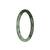 A close-up image of a small, round olive green jade bangle with pale green accents.