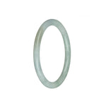 A close-up image of a petite round traditional jade bangle bracelet. The bracelet is certified natural white with pale green hues. It is a beautiful and elegant accessory by MAYS™.