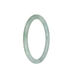 A close-up image of a petite round jade bangle bracelet in a beautiful shade of white with hints of pale green. The bracelet is made from high-quality traditional jade and has a smooth and polished surface. It measures 61mm in diameter, making it a delicate and elegant accessory. This jade bangle is from the MAYS collection, known for their exquisite craftsmanship and attention to detail.