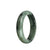 A beautiful half moon-shaped Burma Jade bangle bracelet featuring real grade A green and light grey with black patterns.