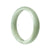A beautiful light green Burma jade bangle bracelet with a half moon shape, made from high-quality grade A jade. Perfect for adding a touch of elegance to any outfit.