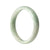 A pale green Burma Jade bangle bracelet with a half moon shape, 57mm in size.