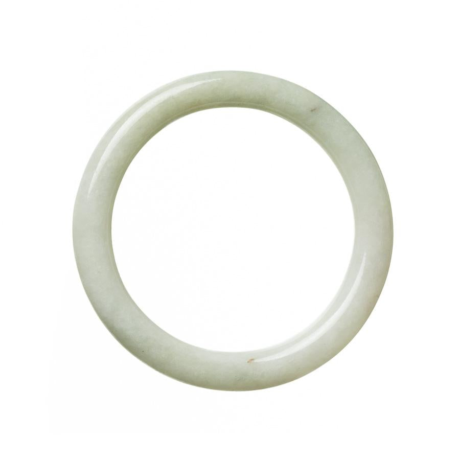 A pale green lavander traditional jade bangle bracelet, made of genuine Grade A jade. The bracelet is round and measures 59mm in diameter. Sold by MAYS GEMS.