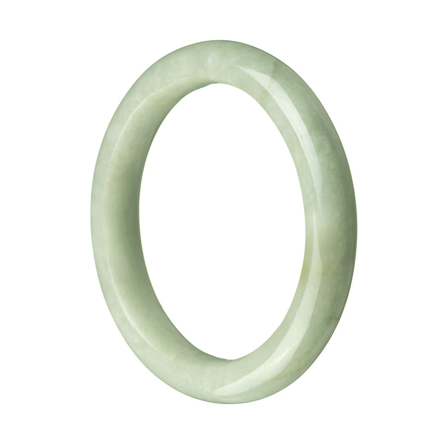 A close-up photo of a beautiful green jade bangle bracelet. The bracelet is made of genuine untreated green jadeite jade and has a semi-round shape. It measures 59mm in diameter. The jade stone has a smooth and glossy surface, showcasing its natural beauty. The bracelet is a stunning piece of jewelry, perfect for adding elegance and sophistication to any outfit.