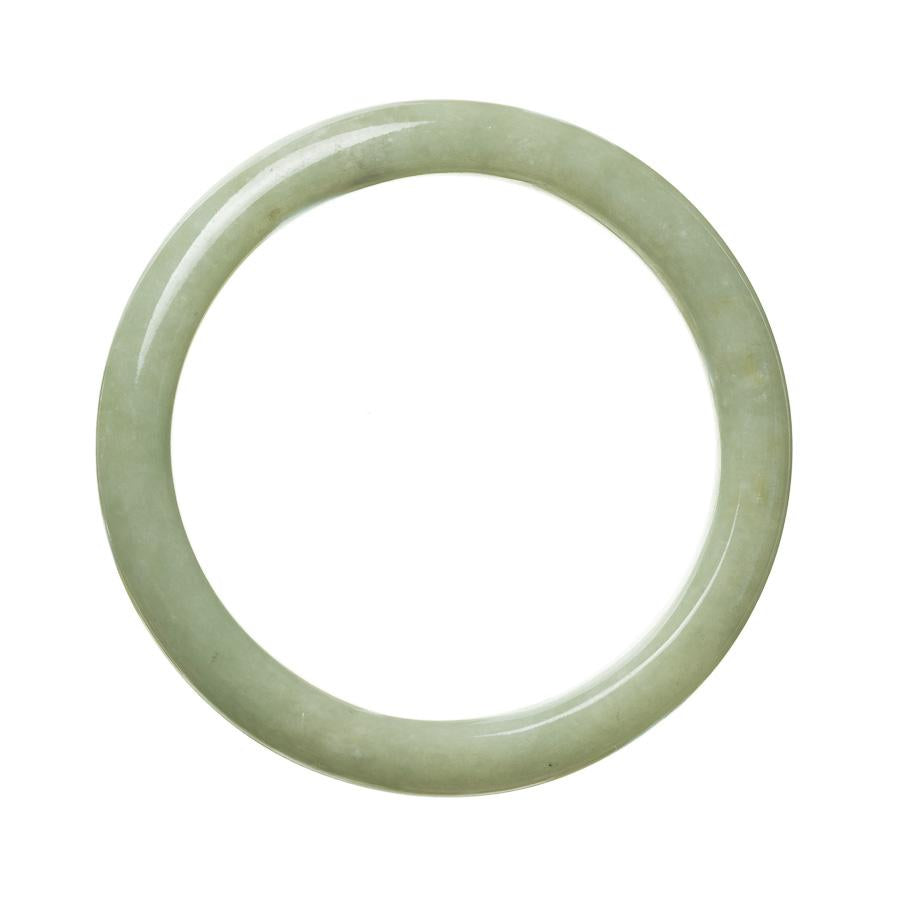 A close-up image of an authentic natural green Burmese jade bracelet. The bracelet is 61mm in diameter and has a semi-round shape. It showcases the vibrant green color and smooth texture of the jade. The bracelet is beautifully crafted and perfect for adding an elegant touch to any outfit.