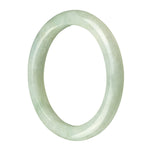 A pale green Burmese jade bangle bracelet with a semi-round shape, showcasing the natural beauty of the stone.