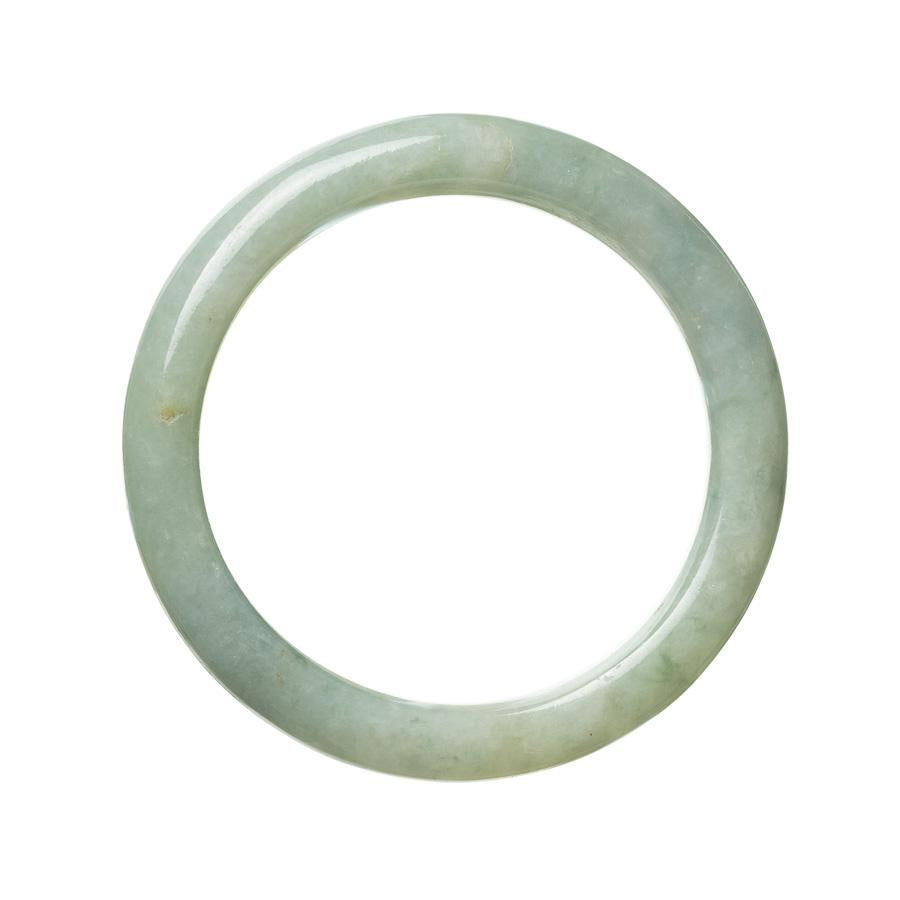 A beautiful semi-round jade bangle from Burma, featuring genuine untreated green jade. The bangle has a diameter of 62mm and is a stunning addition to any jewelry collection.