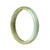 A half moon-shaped real grade A green traditional jade bangle in a beautiful brownish green color. Perfect for adding a touch of elegance and style to any outfit.