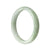 An exquisite, half-moon shaped Type A pale green lavender jadeite jade bangle measuring 57mm in diameter, sourced from MAYS GEMS.