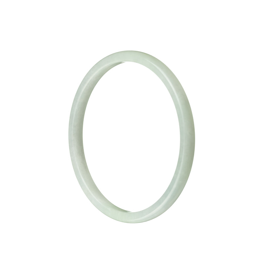 Image of a thin light green jade bangle, showcasing its authentic and traditional design.