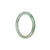 A round, child-sized jade bangle bracelet in a beautiful green and white color.