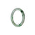 A small, round, child-sized jade bangle in a beautiful green and white color.