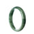 A beautiful green Burma Jade bangle bracelet with a 57mm half moon shape.