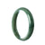 A stunning half moon shaped green jade bracelet, measuring 57mm in size.