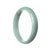 A pale green Burma jade bangle bracelet, featuring a 57mm half moon shape.